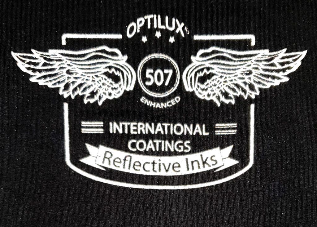 Emblem design printed with Optilux Enhanced Reflective 507 ink